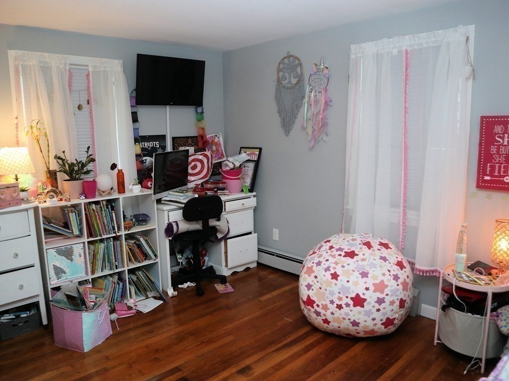 12 Tecumseh Road Bourne, MA 02562 - Photo 18 of 36 a bedroom with furniture and a wooden floor