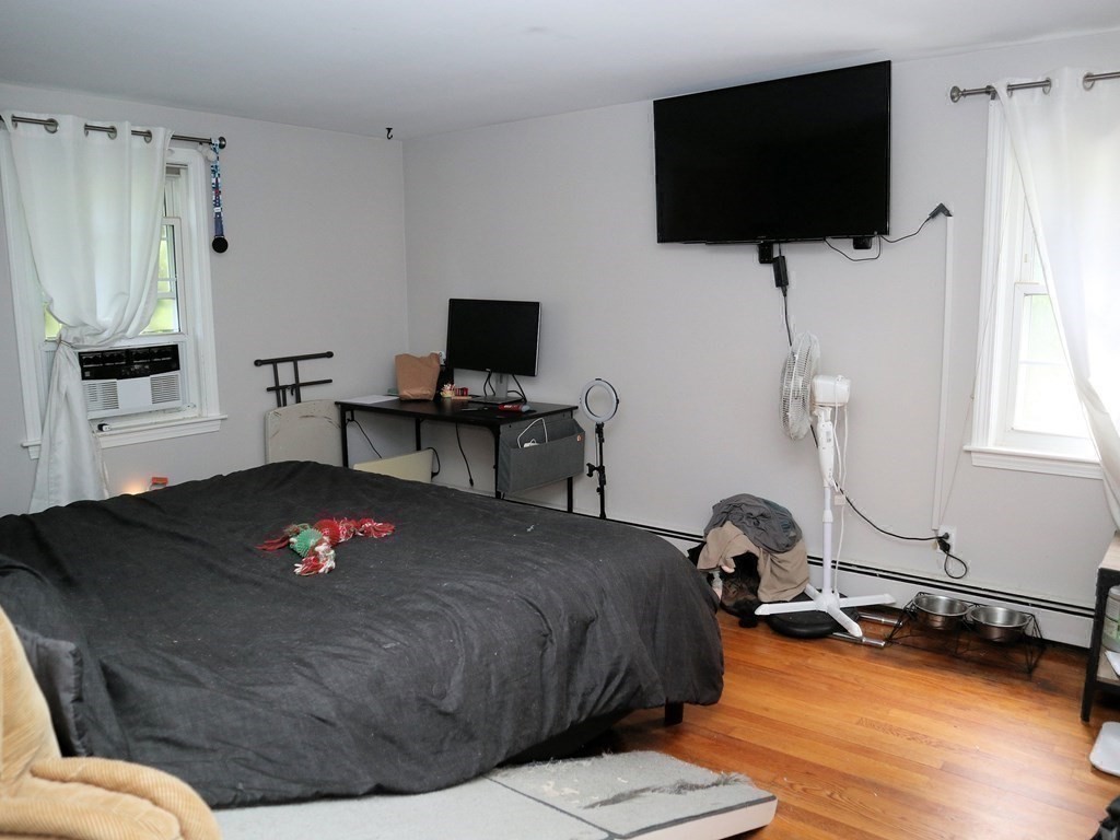 12 Tecumseh Road Bourne, MA 02562 - Photo 19 of 36 a living room with furniture and a flat screen tv
