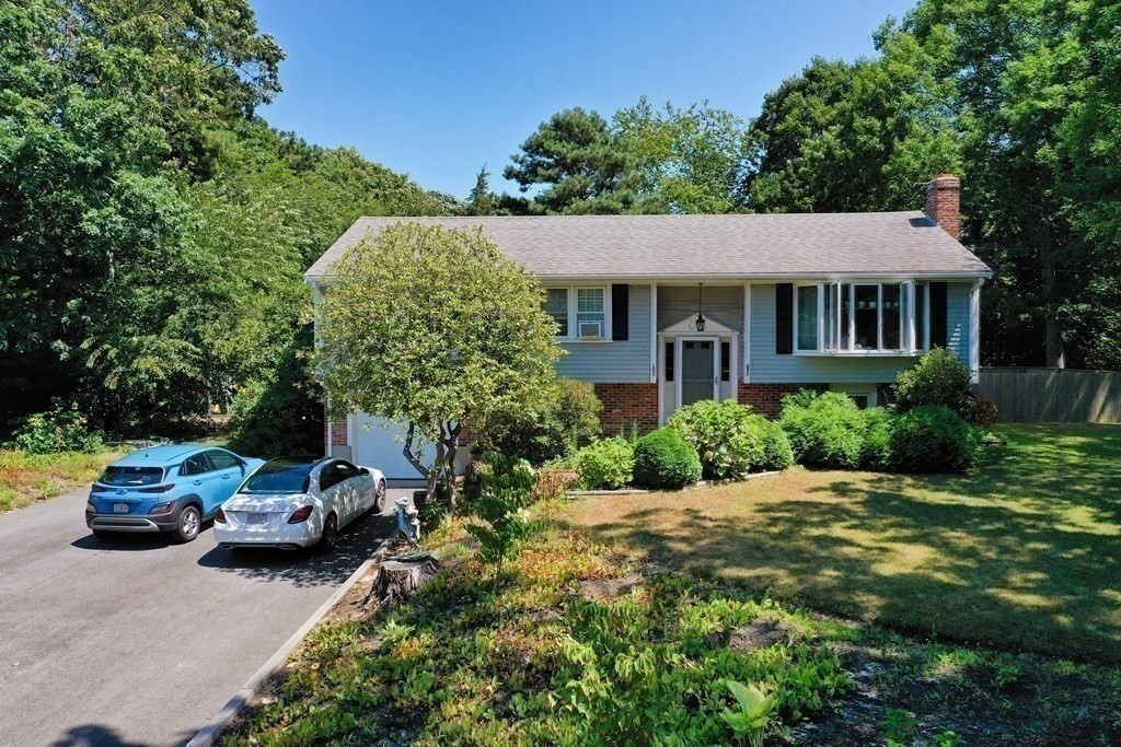 12 Tecumseh Road Bourne, MA 02562 - Photo 20 of 36 a view of a car parked in front of a house