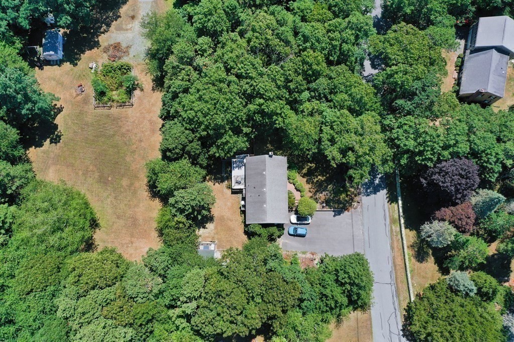 12 Tecumseh Road Bourne, MA 02562 - Photo 21 of 36 an aerial view of a house with outdoor space and trees all around