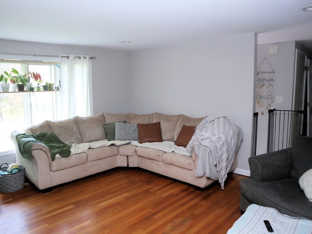12 Tecumseh Road Bourne, MA 02562 - Photo 5 of 36 a living room with furniture and a large window
