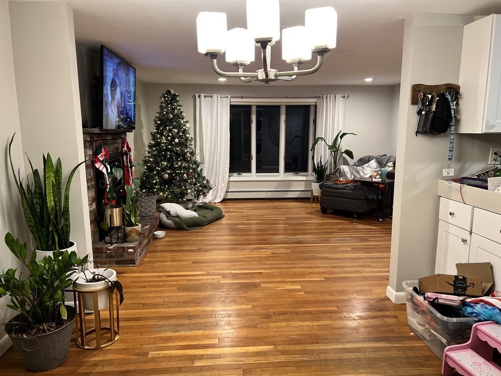 12 Tecumseh Road Bourne, MA 02562 - Photo 6 of 36 a living room with furniture and a potted plant