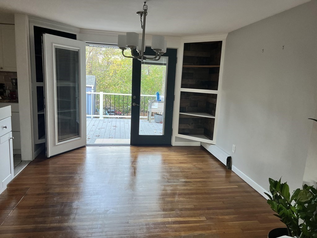 12 Tecumseh Road Bourne, MA 02562 - Photo 9 of 36 a view of an empty room with wooden floor and a window