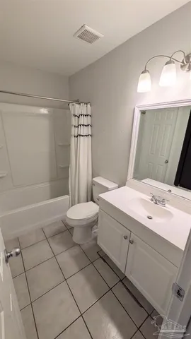 a bathroom with a shower and toilet