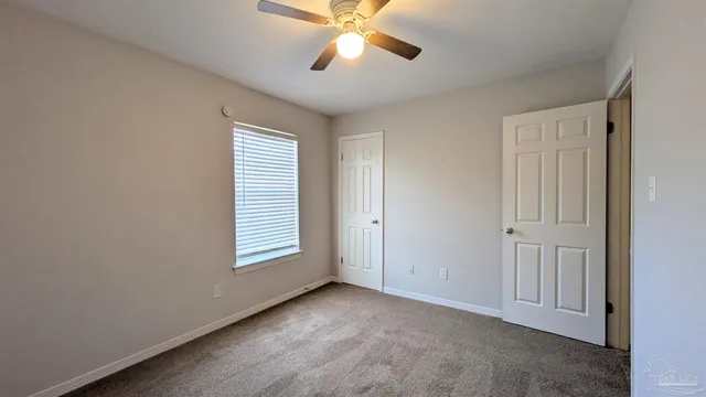 a view of room with ceiling fan