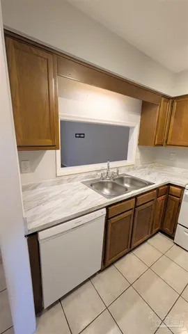 a kitchen with a stove and a sink