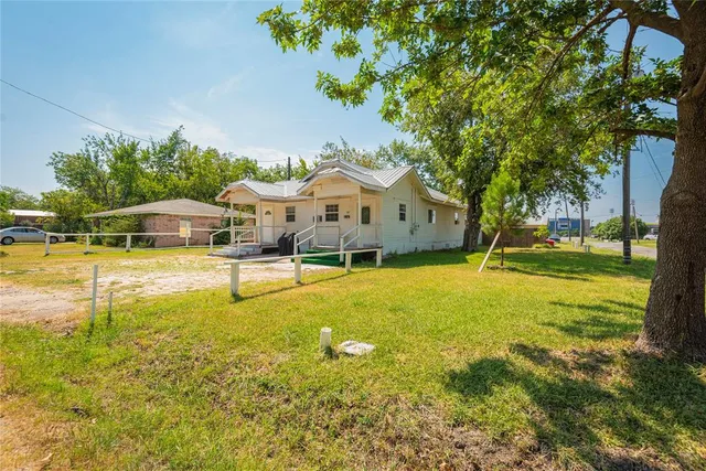 a view of a swimming pool with an outdoor space and seating area
