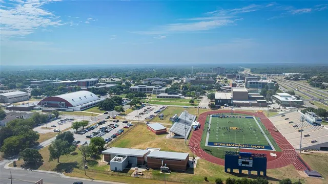 an aerial view of residential houses with outdoor space