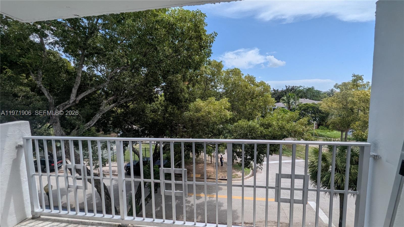445 Southwest 11th Street, Unit 408 Miami, FL 33130 - Photo 15 of 29 a view of a wooden fence and trees