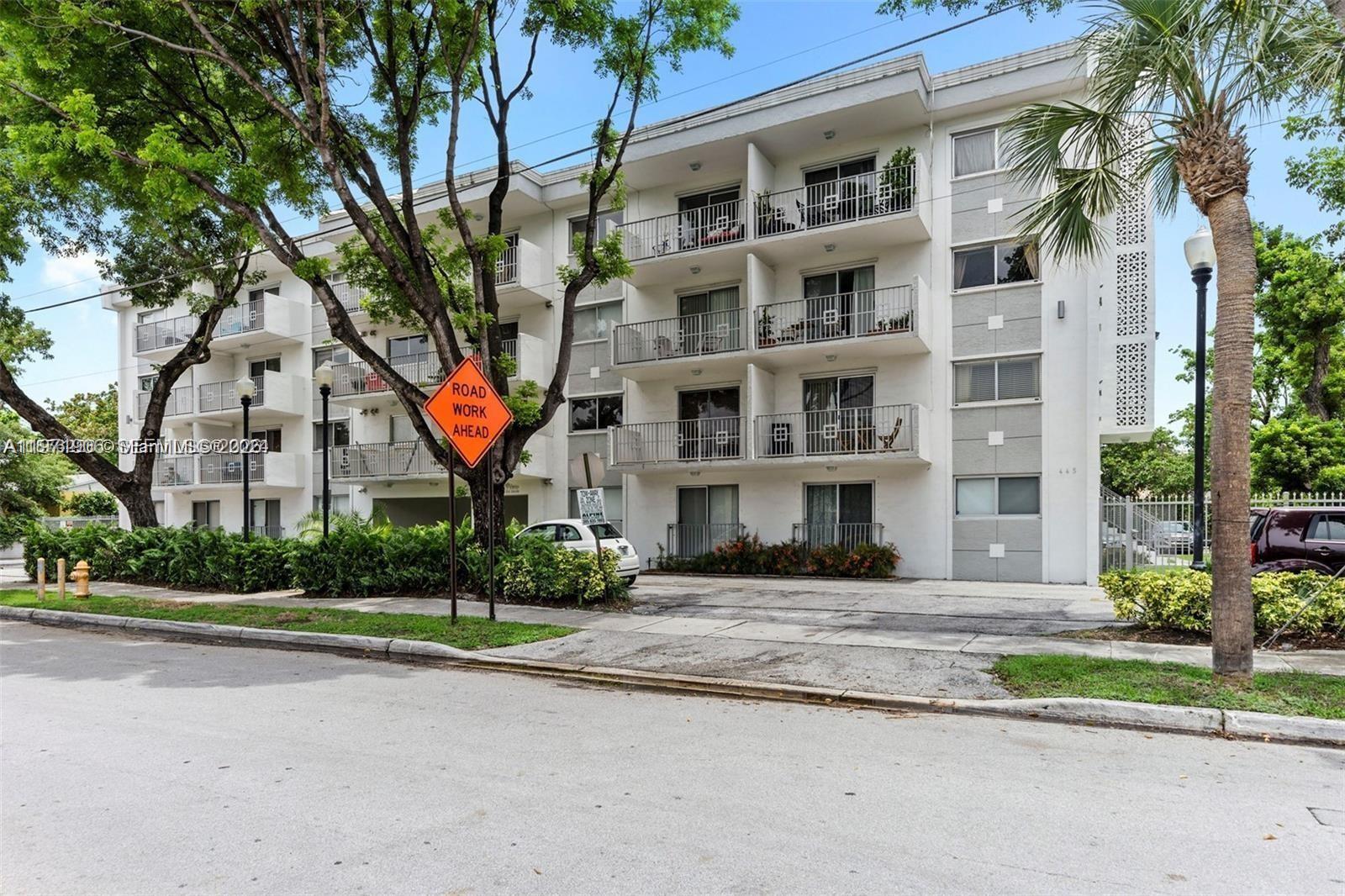 445 Southwest 11th Street, Unit 408 Miami, FL 33130 - Photo 2 of 29 a front view of building with yard