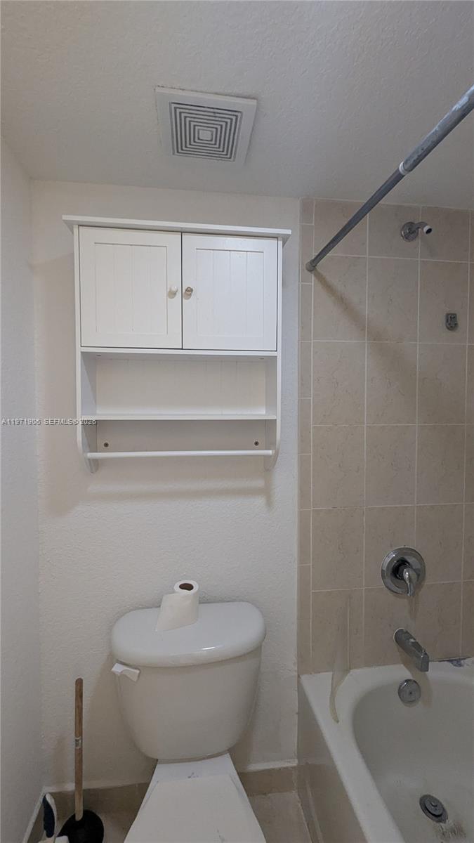 445 Southwest 11th Street, Unit 408 Miami, FL 33130 - Photo 26 of 29 a bathroom with a sink a toilet and shower