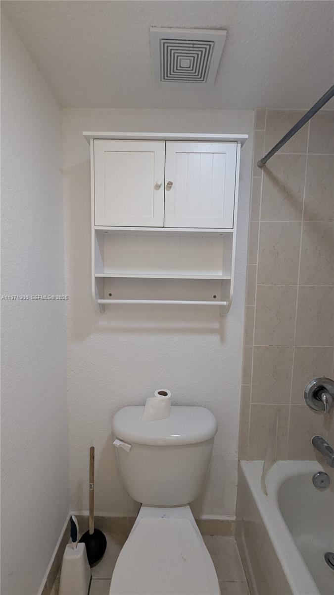 445 Southwest 11th Street, Unit 408 Miami, FL 33130 - Photo 27 of 29 a bathroom with a sink and a toilet
