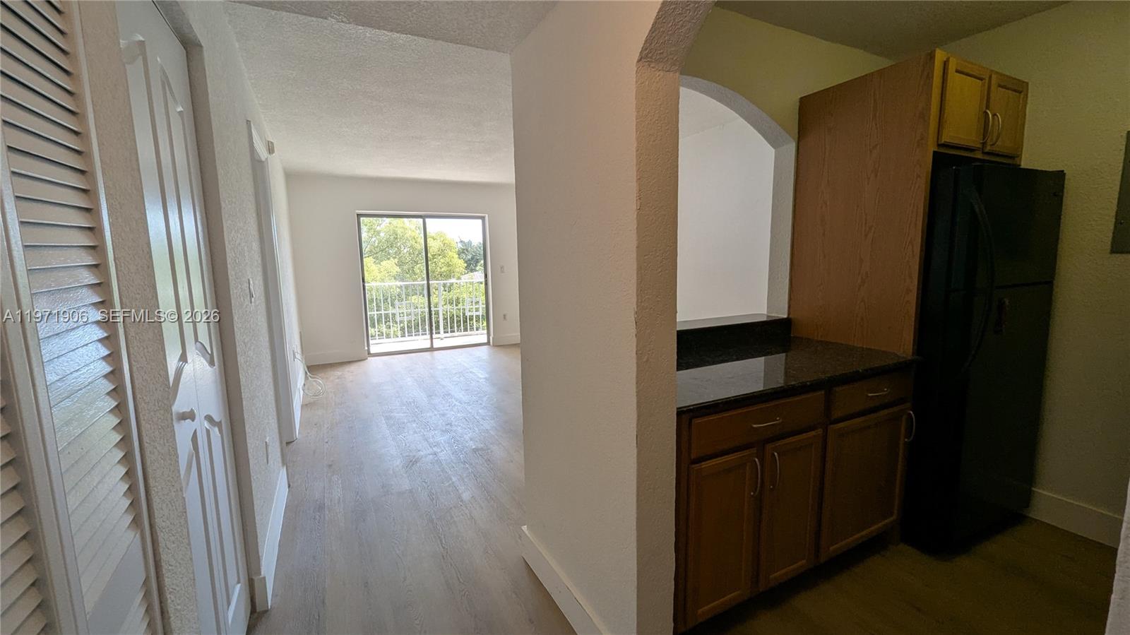 445 Southwest 11th Street, Unit 408 Miami, FL 33130 - Photo 5 of 29 a view of hallway with wooden floor