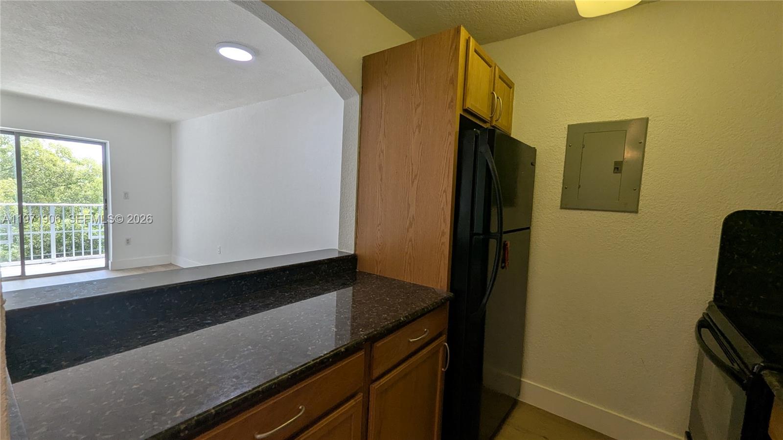 445 Southwest 11th Street, Unit 408 Miami, FL 33130 - Photo 8 of 29 a view of kitchen with a sink a refrigerator and window
