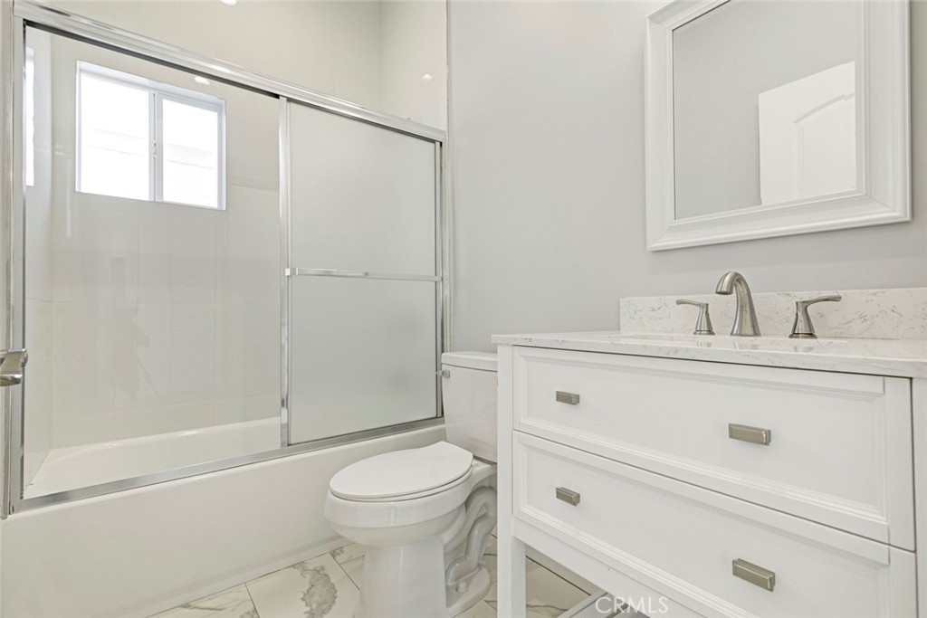 10499 Yolanda Avenue Porter Ranch, CA 91326 - Photo 15 of 37 a bathroom with a sink a toilet and shower