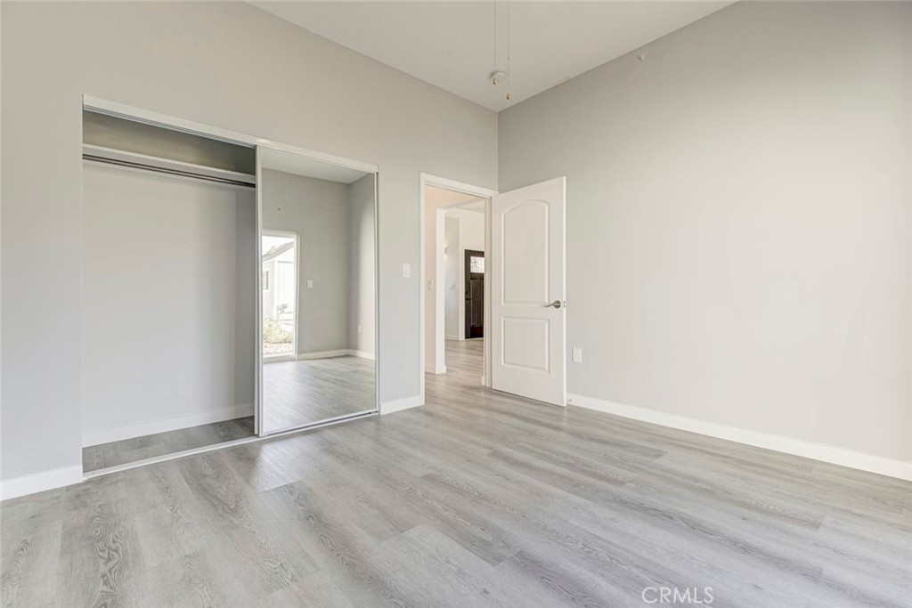 10499 Yolanda Avenue Porter Ranch, CA 91326 - Photo 18 of 37 an empty room with wooden floor and windows