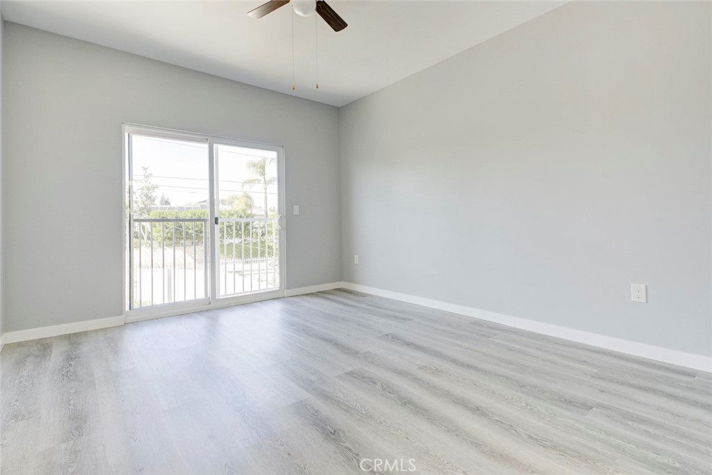 10499 Yolanda Avenue Porter Ranch, CA 91326 - Photo 24 of 37 a view of an empty room with wooden floor and a window