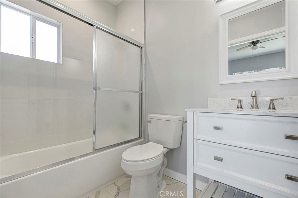 10499 Yolanda Avenue Porter Ranch, CA 91326 - Photo 26 of 37 a bathroom with a sink a toilet and shower