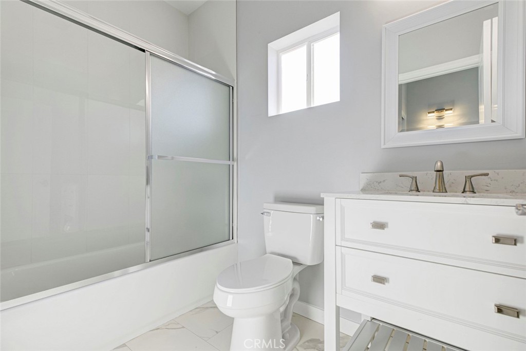 10499 Yolanda Avenue Porter Ranch, CA 91326 - Photo 30 of 37 a bathroom with a sink toilet and shower