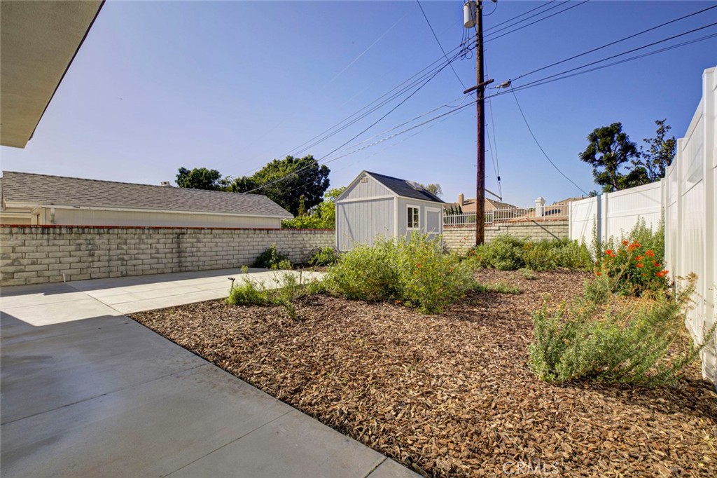 10499 Yolanda Avenue Porter Ranch, CA 91326 - Photo 33 of 37 a front view of a house with a yard