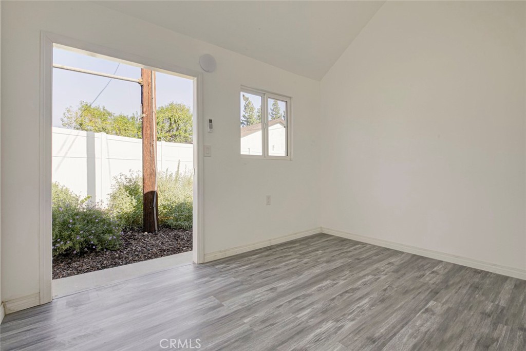 10499 Yolanda Avenue Porter Ranch, CA 91326 - Photo 36 of 37 an empty room with wooden floor and windows