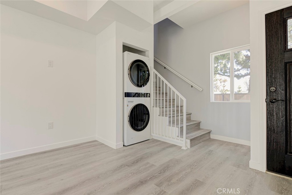 10499 Yolanda Avenue Porter Ranch, CA 91326 - Photo 9 of 37 a utility room with dryer and washer