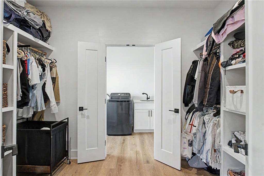 376 Hunnicut Road Southeast Mableton, GA 30126 - Photo 39 of 73 a view of walk in closet with clothes and shoes