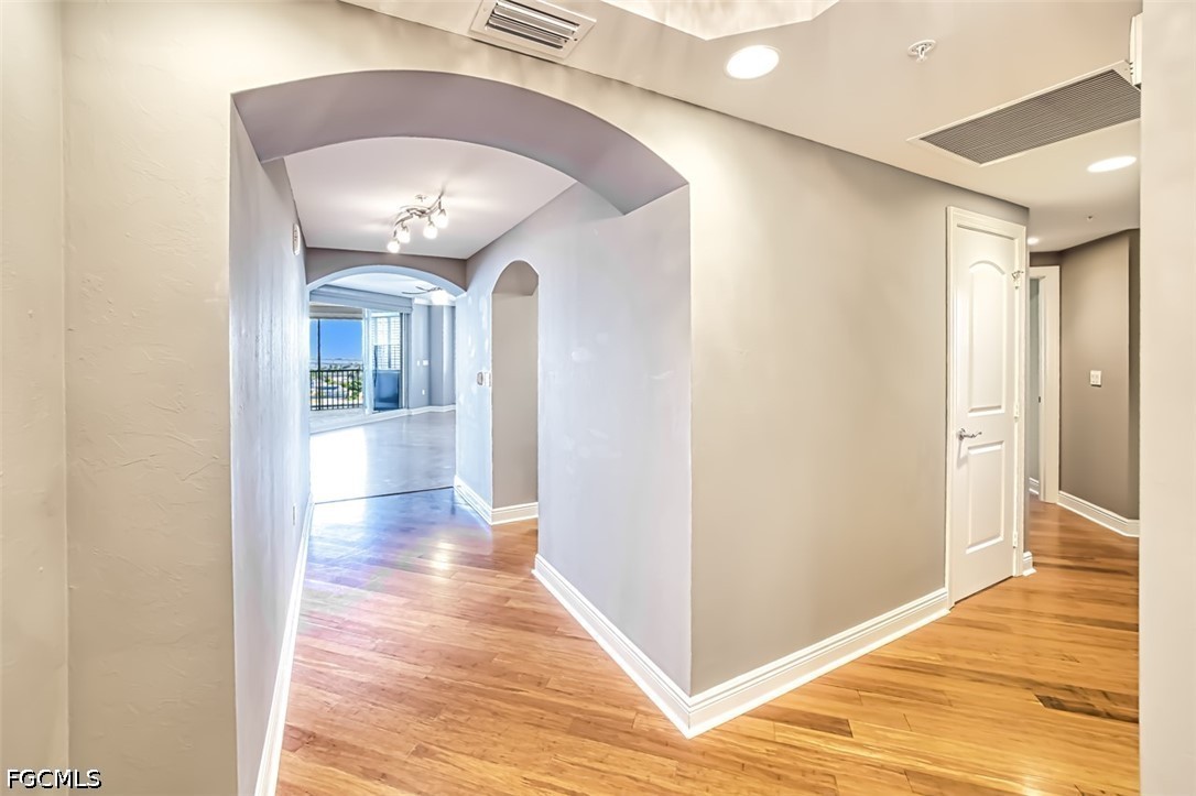 2104 West First Street, Unit 1004 Fort Myers, FL 33901 - Photo 26 of 42 a view of a hallway with wooden floor