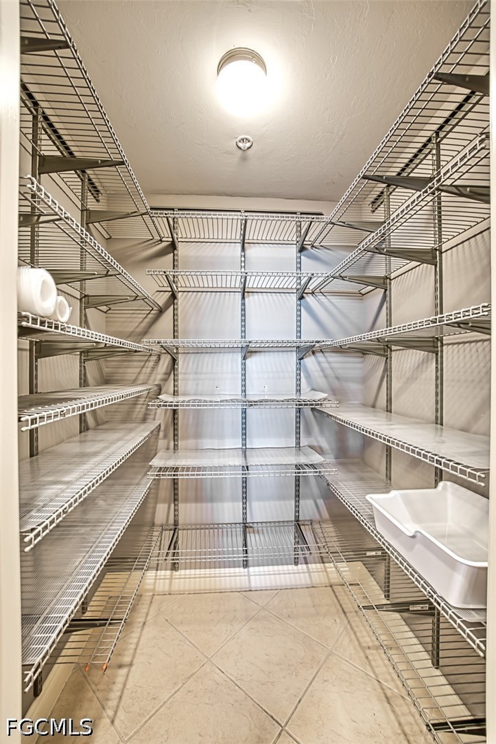 2104 West First Street, Unit 1004 Fort Myers, FL 33901 - Photo 28 of 42 a view of a room with shelves on the wall