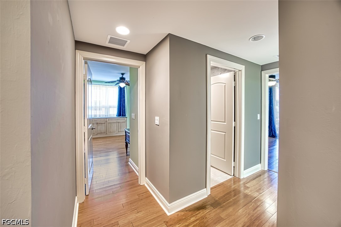 2104 West First Street, Unit 1004 Fort Myers, FL 33901 - Photo 31 of 42 a view of a hallway with wooden floor