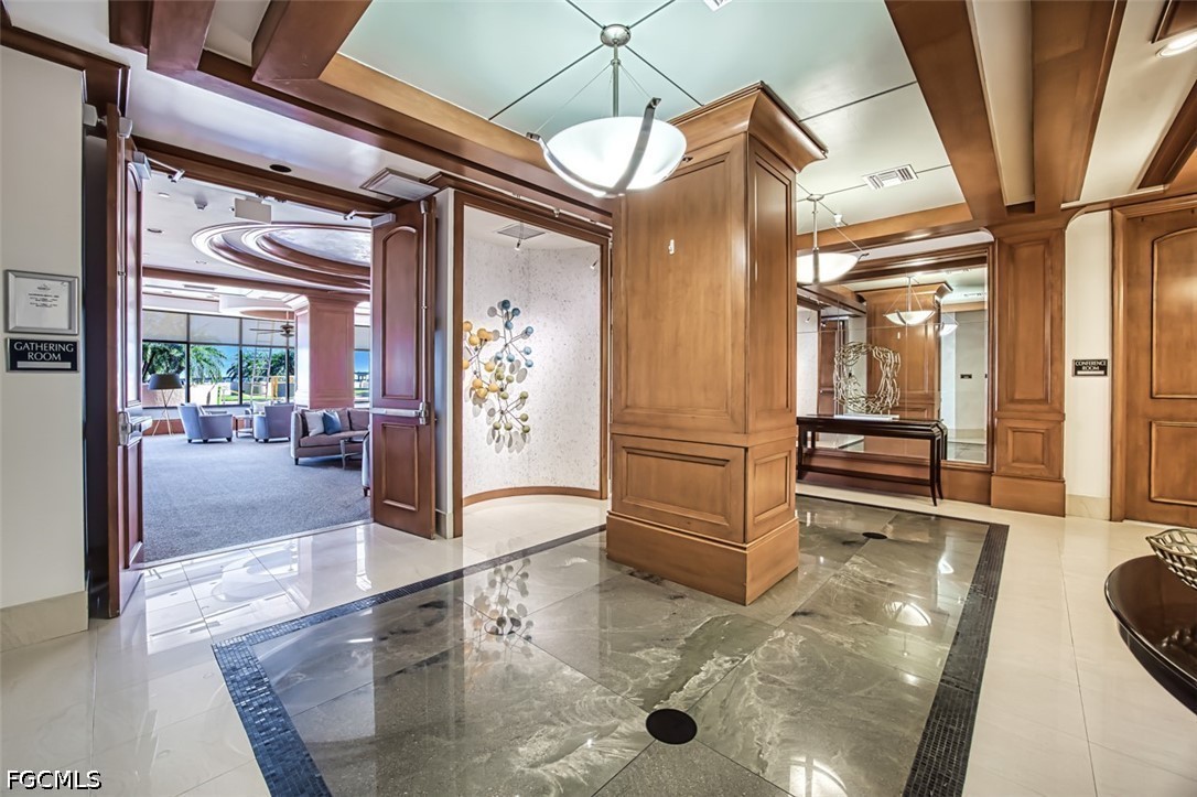 2104 West First Street, Unit 1004 Fort Myers, FL 33901 - Photo 38 of 42 a lobby with furniture and a glass door