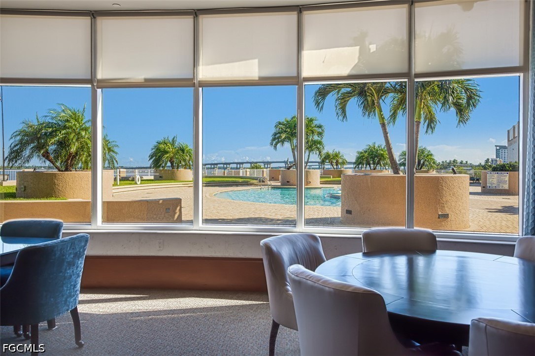 2104 West First Street, Unit 1004 Fort Myers, FL 33901 - Photo 40 of 42 a view of a dining room with furniture window and outside view