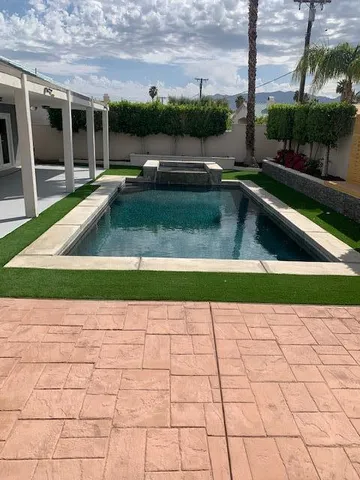 a view of swimming pool with seating space and outdoor seating