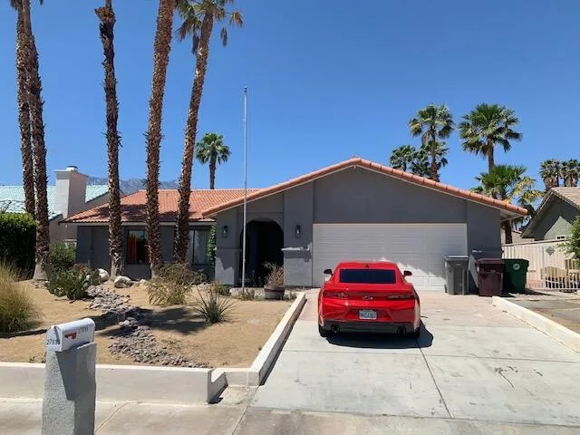 a car parked in front of a house