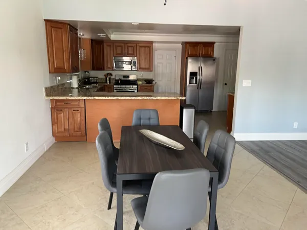 a dining room with furniture and window