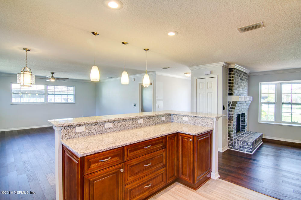 1634 Derringer Road Jacksonville, FL 32225 - Photo 11 of 41 a bathroom with a granite countertop sink and a large mirror