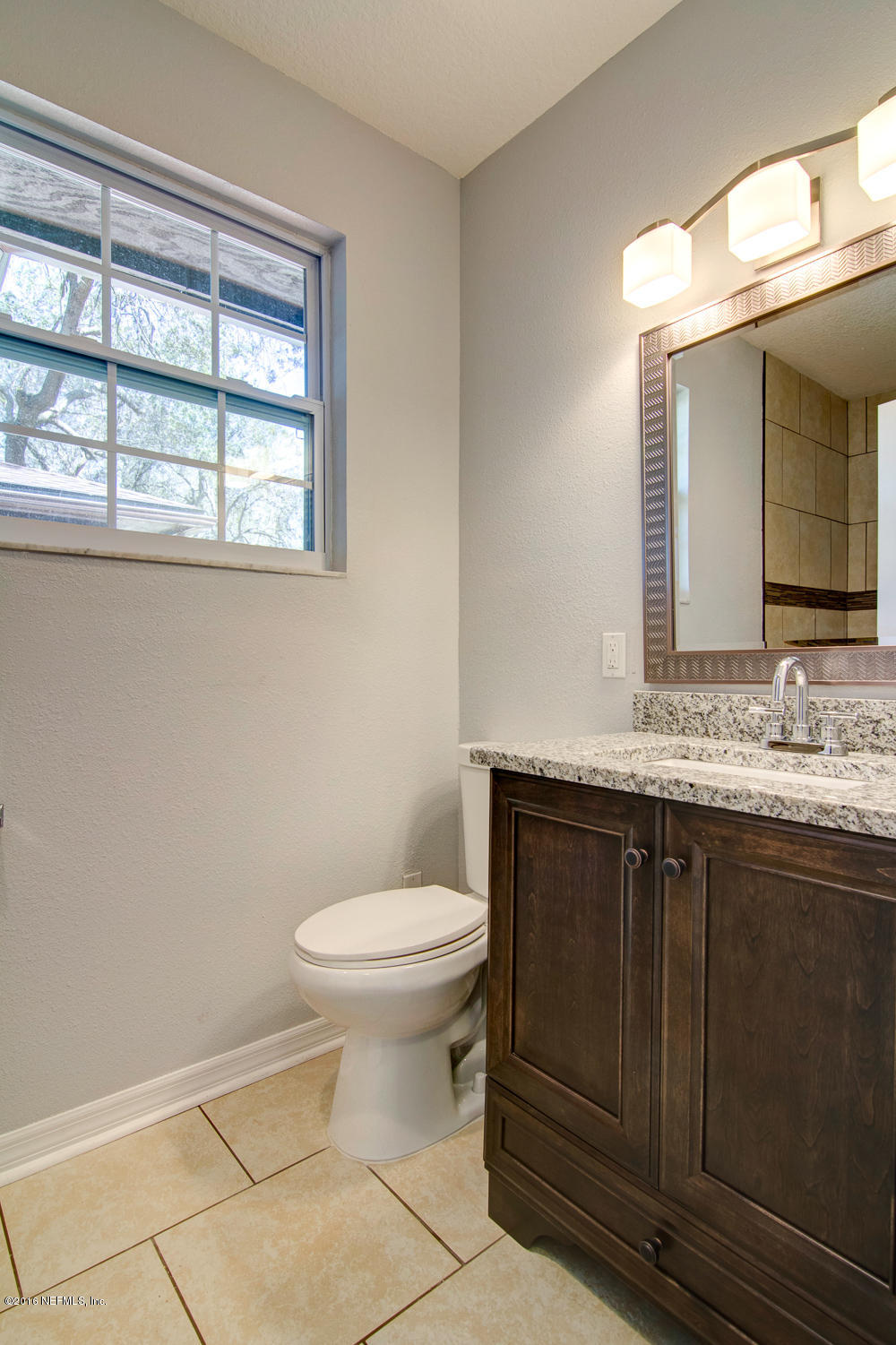 1634 Derringer Road Jacksonville, FL 32225 - Photo 23 of 41 a bathroom with a sink and a toilet