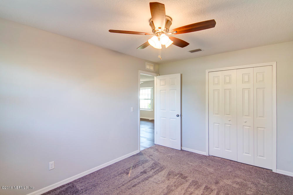 1634 Derringer Road Jacksonville, FL 32225 - Photo 27 of 41 wooden floor in an empty room