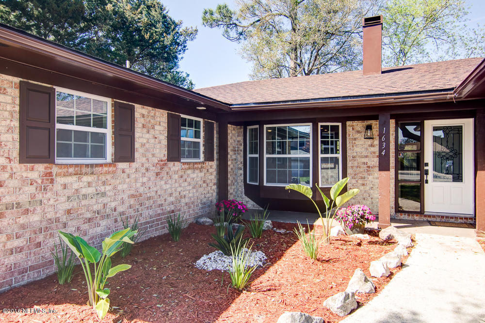1634 Derringer Road Jacksonville, FL 32225 - Photo 3 of 41 a front view of a house with garden