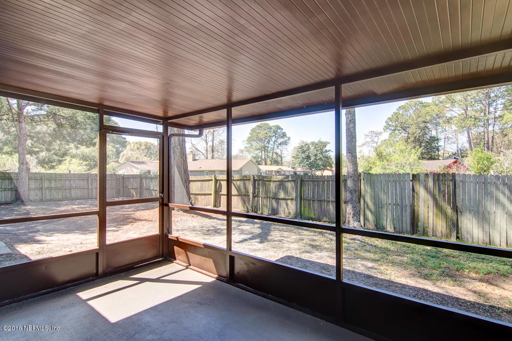 1634 Derringer Road Jacksonville, FL 32225 - Photo 36 of 41 a view of a room with wooden floor and outdoor space