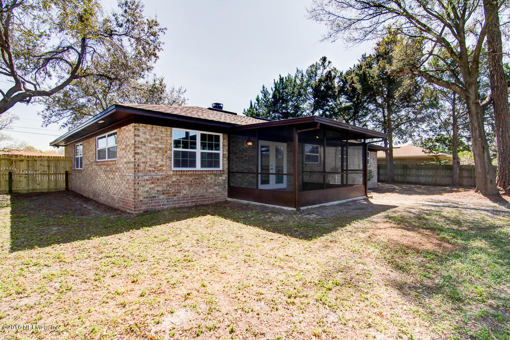 1634 Derringer Road Jacksonville, FL 32225 - Photo 38 of 41 a front view of a house with a yard and garage