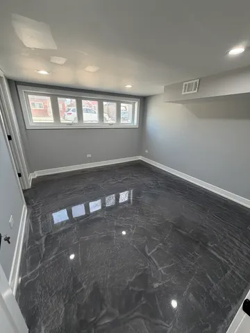 a view of an empty room and window