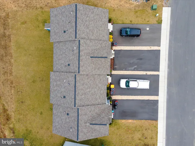a aerial view of a house with swimming pool