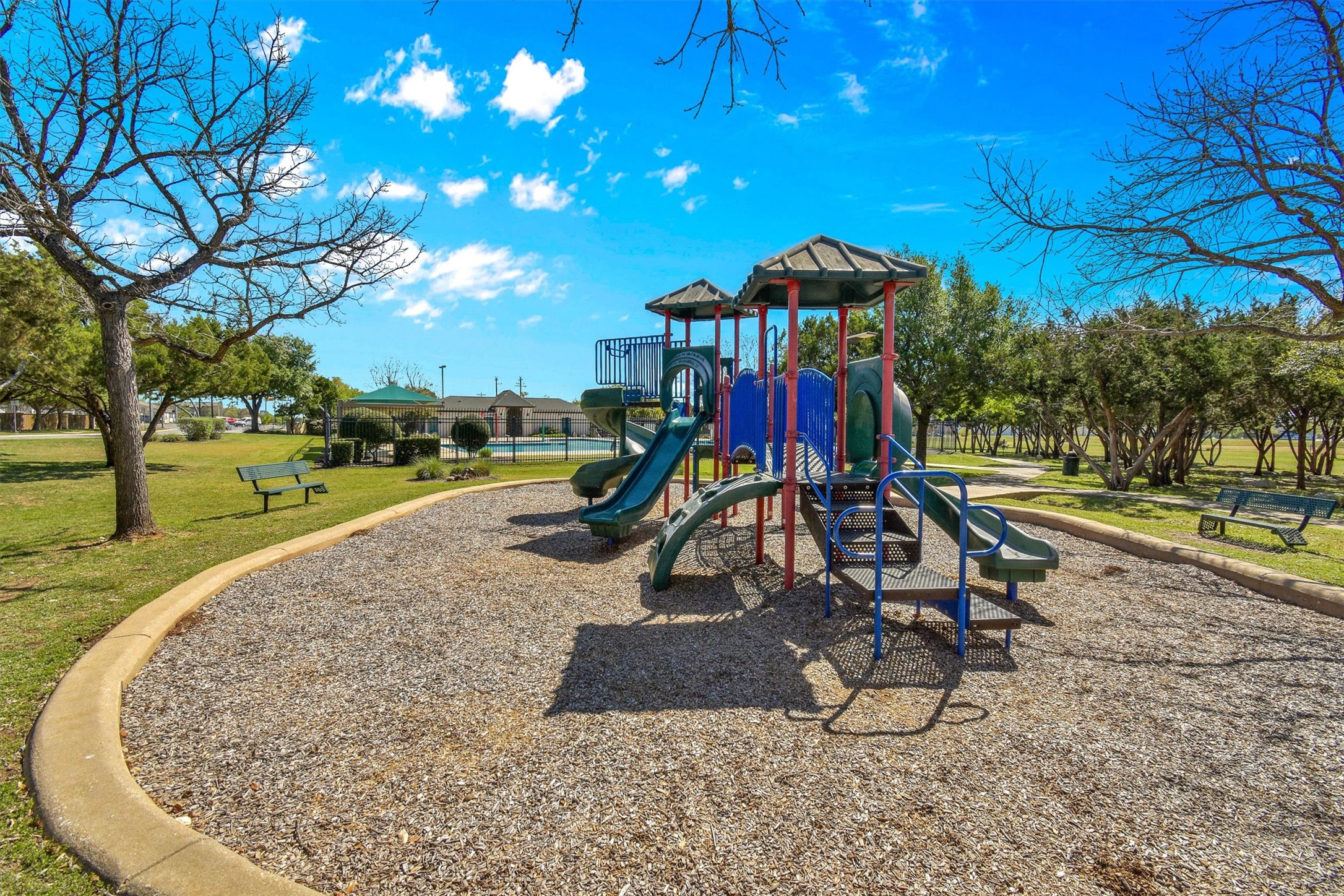 92 Verde Ranch Loop Leander, TX 78641 - Photo 33 of 37 Communal playground featuring a lawn