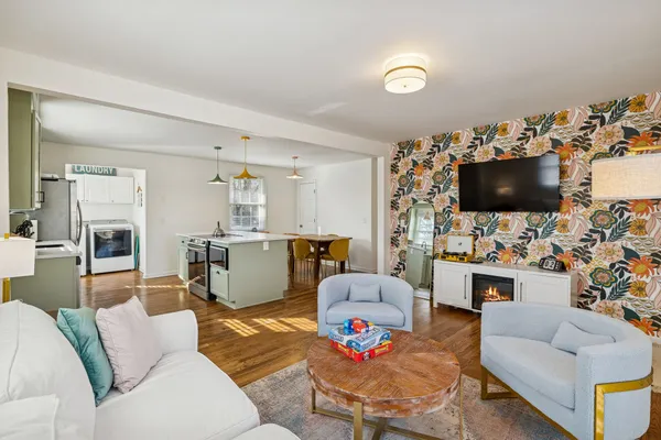 a living room with furniture and a flat screen tv