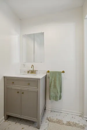 a bathroom with a sink and mirror