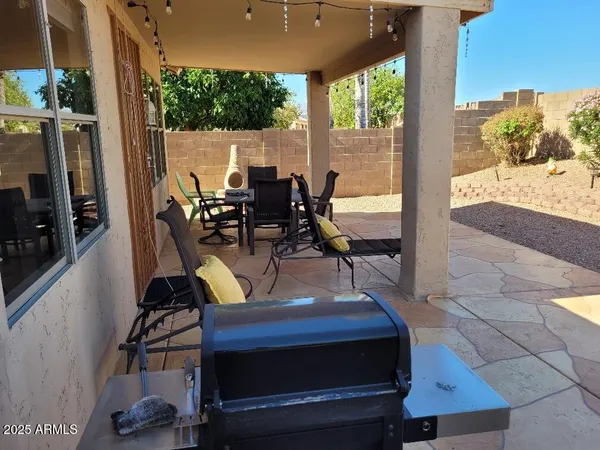 a view of an outdoor sitting area with furniture