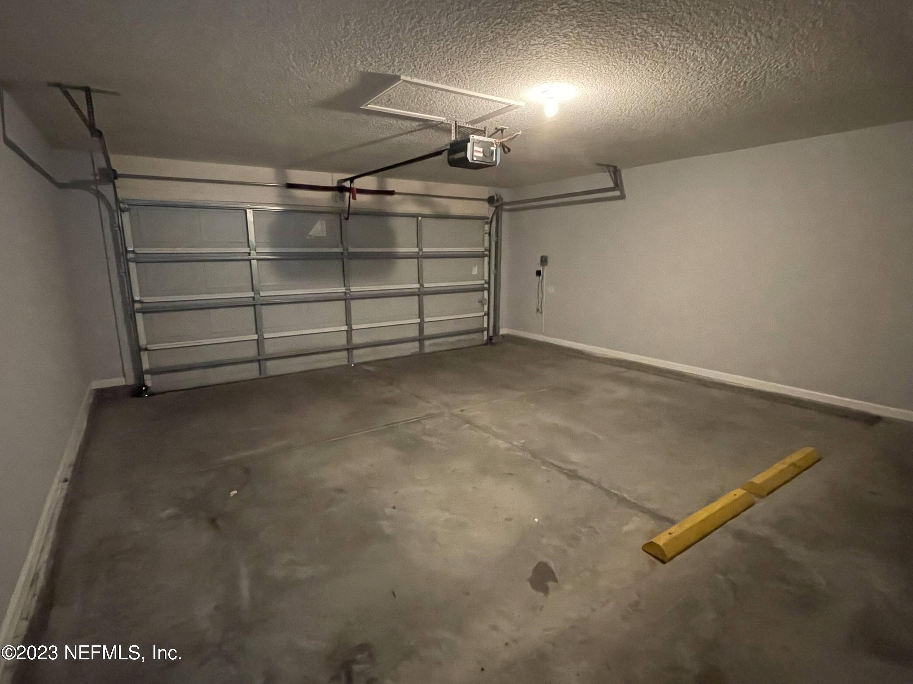 86050 Sands Way Yulee, FL 32097 - Photo 15 of 15 a view of a room with racks on the wall