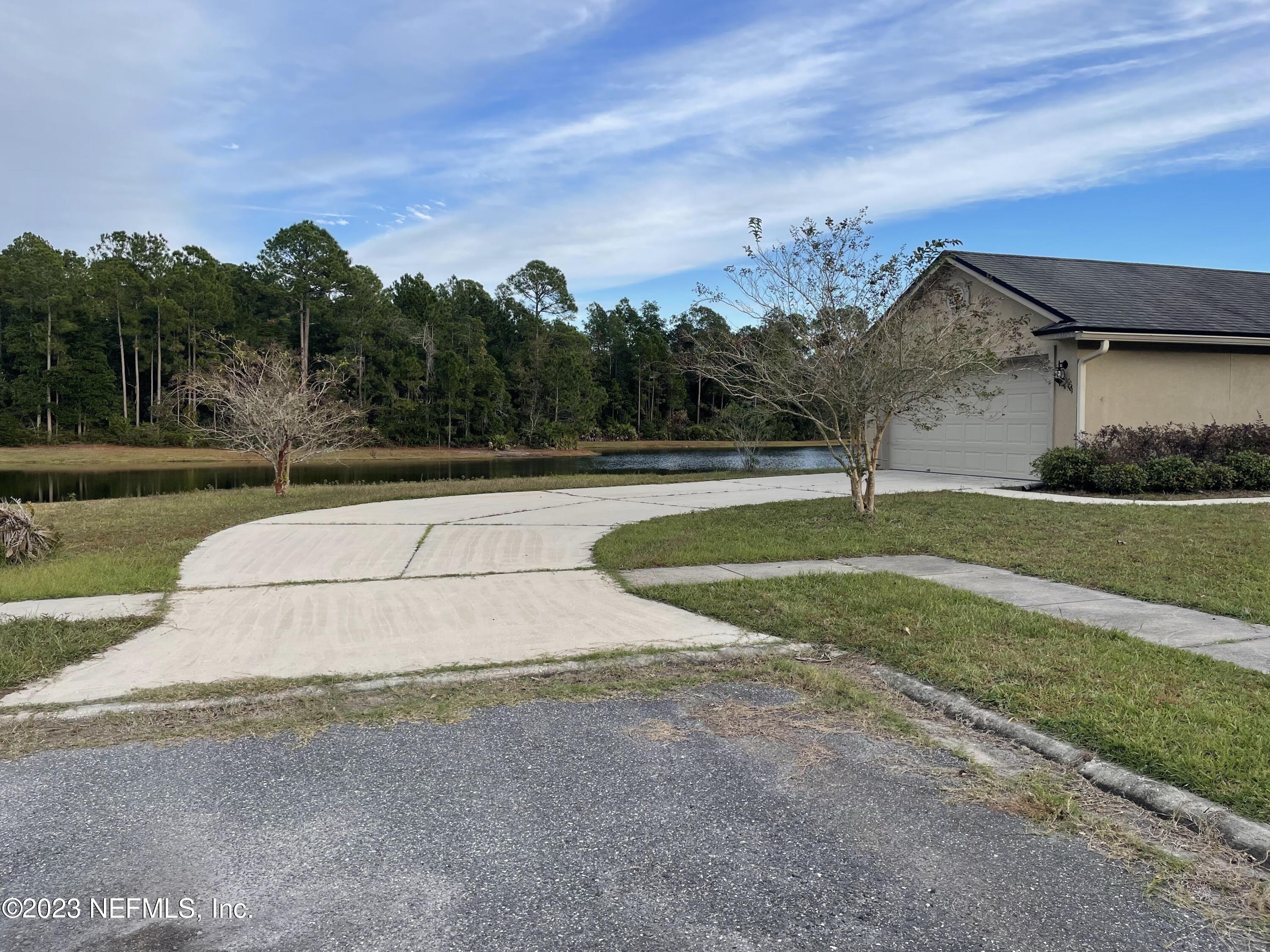 86050 Sands Way Yulee, FL 32097 - Photo 2 of 15 a view of a house with a yard
