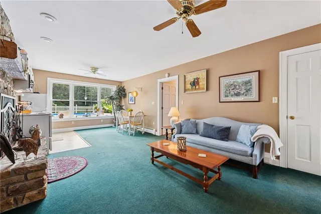 a living room with furniture and a rug
